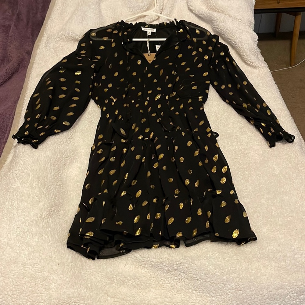 Black and gold polka dotted dress.
